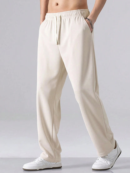 Men's Regular Fit Solid Color Drawstring Waist Sports Pants Autumn and Winter Casual Pocket Design Pants Men's Daily Trousers